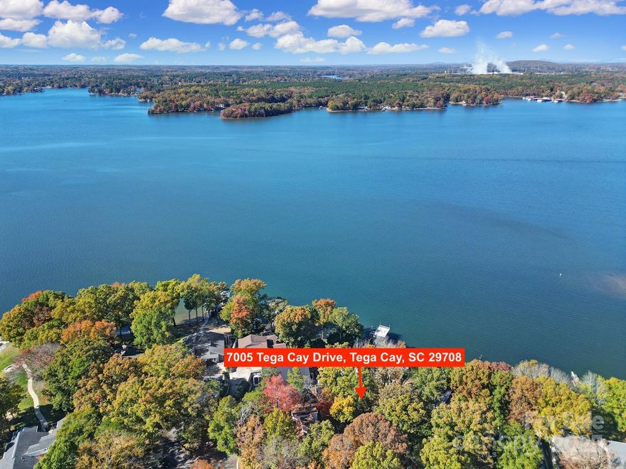 Welcome to this Rare Piece of Lake Wylie History! Discover endless possibilities with this spacious home situated on a half acre double lot right on the shores of Lake Wylie, complete with its own dock and stunning big water, main channel views. Originally owned by prominent Civil Rights Attorney Julius Chambers and then updated by renowned Architect and Mayor of Charlotte Harvey Gantt. Home also has an oversized 2 car garage with additional assigned parking spots in the culdesac. Brimming with character and charm, this property offers a unique opportunity to update and personalize a true classic as it was one of Tega Cay's first "model homes" — creating your dream lakeside retreat. Enjoy the serenity of waterfront living with the convenience of being in a top-rated school district and close to shopping, dining, and all that the area has to offer including the neighboring marina and nearby golf course and sport courts. Homes like this don't come available all that often so embrace the chance to own a piece of Lake Wylie history and make it your own! Kitchen and bathrooms have all been updated with custom built ins at the primary closet. Dual primary suites on opposite ends of the house. No HOA! House is currently listed well below our recent appraisal as seller is motivated and not looking to do any repairs as they no longer live in the area and haven't lived in the home for a few years now.