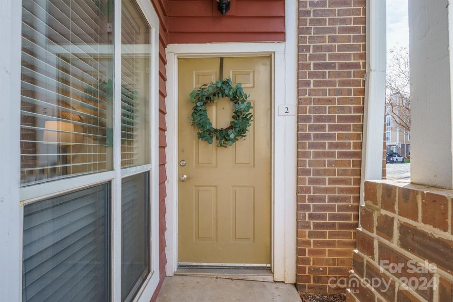 Charming light filled 2 bed 2 bath end unit ground floor condo in the heart of Elizabeth. No stairs to enter this beautiful home with open floorplan and updated kitchen.  Kitchen with stainless steel appliances, stone countertops and white painted cabinets.  Dining area leading to living room and outdoor living. Owners suite with new carpet, vanity and large walk in closet.  Secondary bedroom with walk in closet and room to work from home.  Secondary bath with new vanity.  Covered outdoor patio with sliders from living room and owners suite. Location is close to restaurants and nightlife. Easy commute to uptown, interstate and Presbyterian Hospital. Pool, fitness center, clubhouse and water bill included in HOA dues.  New roof in 2023.