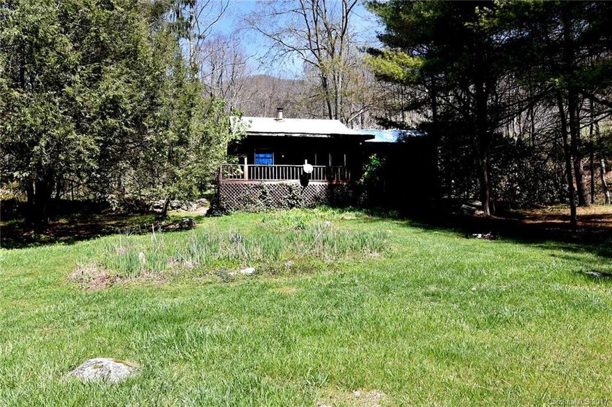 Cute, cute, cute, cabin. 2 bedrooms, 1.5 baths.  Open floor plan with woodstove in living room and Mitsubishi Mini Split for heat and air in dining room.  Large, front covered deck is where you will spend most of your time from spring through fall.  Picture yourself shucking corn and stringing bean while sipping on sweet tea.  Oh yes, the simple life!  Laundry is located in an attached room that you access from the outside.