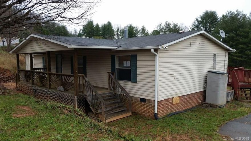 3 bed/2 bath manufactured home in Hidden Meadow Estates. This split-bedroom layout includes a living room with fireplace, master suite, eat-in kitchen, and laundry. Exterior features include an inviting covered front deck, rear deck, and large outbuilding.