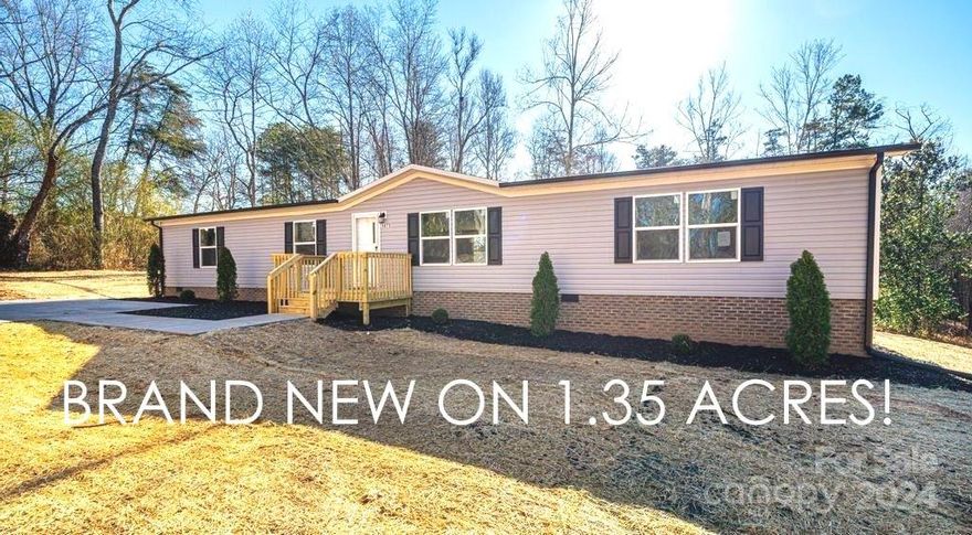 BRAND NEW ON 1.35 ACRES!! This three bedroom, two bathroom Oakwood home offers 1,808 HSF and is situated on a quiet, private 1.35 acre lot in the Baton area of southern Caldwell County just outside Granite Falls. Features include low maintenance vinyl siding, two large wooden decks, full concrete driveway and parking area, and a private backyard. Inside, the open floor plan offers LVP flooring, living room and separate family room, and kitchen with all appliances, center island and adjoining dining area. The split bedroom layout offers two bedrooms sharing a  bath on one end, with a private primary suite with with huge walk-in closet and full bath on the opposite end of the house. Large utility/mud/laundry room exiting to the rear deck just off kitchen. Convenient location near Baton Elementary School. USDA approved, own today for less than the price of monthly rent!