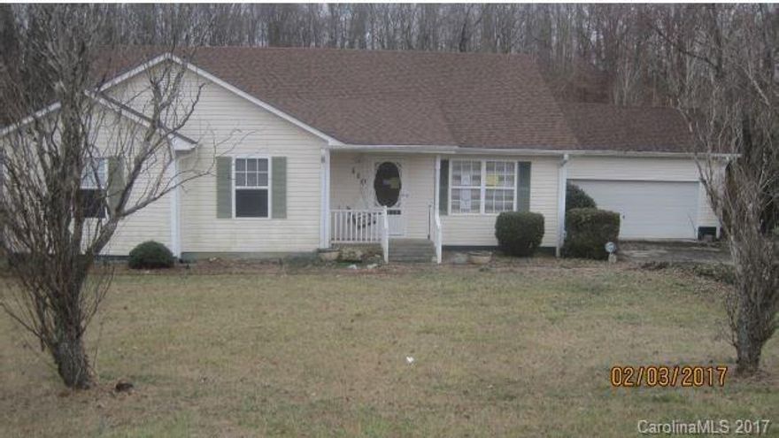 Spacious ranch featuring a covered front porch, a kitchen with a window, 3 bedrooms, 2 bathrooms, and an attached 2 car garage.