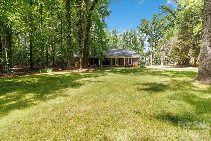 A Secluded Haven:  Brick Ranch on Nearly 3 Acres.  Escape to your own private sanctuary!  This 3 bedroom, 2 bath brick ranch is perfectly positioned on 2.706 acres, offering a rare level of privacy and space.  Inside, the sizable great room with its wood-burning fireplace creates an inviting atmosphere for relaxation.   Enjoy the peace of mind that comes with a 2024 roof replacement and the added versatility of a large unfished basement perfect for a home gym, workshop or additional storage.  Whether you're looking for room to roam outdoors or a solid, low maintenance exterior, this property delivers.  Nestled away from the hustle and bustle!