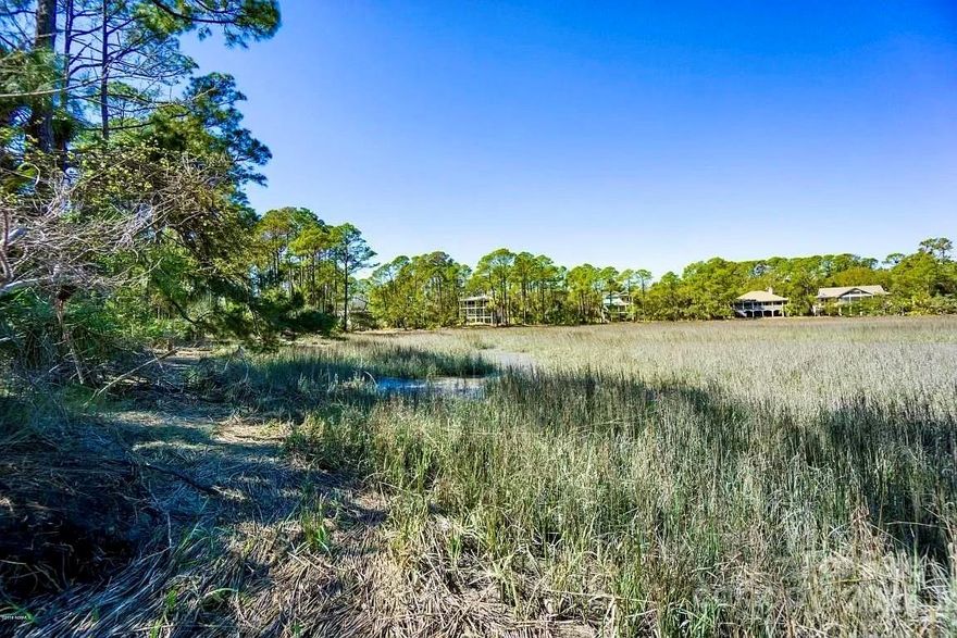 A hidden treasure at the end of Speckled Trout Road, with 110' of stunning marsh front views. This private lot is on a cul-de-sac and has stayed safe from flooding during recent storms. Ideally located near the Ocean Creek Golf Course, Activity Center, and Cabana Club,this lot offers easy access to several Fripp Island Resort amenities. A short golf cart ride away from 24/7 beach access. A prime location with endless potential!