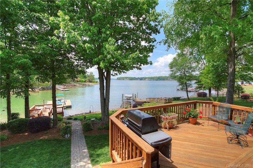 Lake Wylie waterfront with big views and terrific outdoor living spaces! You'll love the covered porch and sunroom overlooking the main channel. Easy living open floor plan, kitchen w/stainless steel appliances, great room with gas fireplace and built-ins. Professional landscaping with in-ground irrigation, dock with boat slip.  Located in Sunset Point, a Rock Hill lakefront community featuring a community pool, boardwalk and resident beach. Ready to move in, a tremendous value in lakefront!