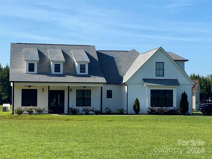 Welcome to 2323 Tart Road...This charming modern farmhouse built in December 2021 is nestled on over an acre of land. Three bedrooms and two beautifully appointed bathrooms provide ample space for comfort and relaxation. The open floor plan seamlessly integrates the living, dining, and kitchen areas, perfect for both entertaining and everyday living. Highlighted by modern finishes and design, the kitchen boasts stainless steel appliances, a large butcher block island, and crisp white cabinetry. An inviting flex room above the garage offers versatile space that can be tailored to suit your needs.
Situated on a corner lot, this home provides both space and convenience. Enjoy the tranquility of country living while being centrally located between York, Clover, and Kings Mountain, making commuting and accessing amenities a breeze. With its blend of modern comforts and farmhouse charm, this property is a perfect haven for those seeking a serene yet connected lifestyle.