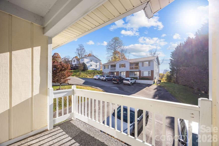 Move-in Ready, Fully Furnished Condo with Fantastic Views! Enjoy beautiful mountain views from this lovely 2BR/2BA second-floor condo in the highly sought-after Junaluska View Condominiums. Rarely available, this unit offers a spacious living room, dining area, and a bright and spacious kitchen with pantry, perfect for entertaining. The primary suite and guest bedroom both have ceiling fans and provide comfort and privacy, while the front and rear porches offer the ideal spots to relax and take in the scenery. A convenient closet opens off the front porch adding additional storage. Conveniently located just minutes from Lake Junaluska, Downtown Waynesville, shopping, dining, and major highways, with easy year-round access. A wonderful and affordable opportunity — turnkey and ready to enjoy!