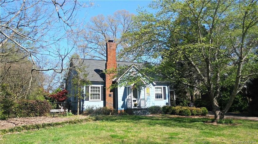 Lovely home offers unique features providing character not found in newer homes.  Enjoy living on a beautiful, quiet street close to downtown and I77.  One wood-burning fireplace and one gas log fireplace make the home unusual in a warm and cozy way. The large fully fenced backyard provides a safe play area for children or pets. Lovely magnolia, Japanese maple and dogwood trees adorn the yard. Shrubs and vegetation form a natural barrier for privacy and beauty. Stained glass doors are stunning.