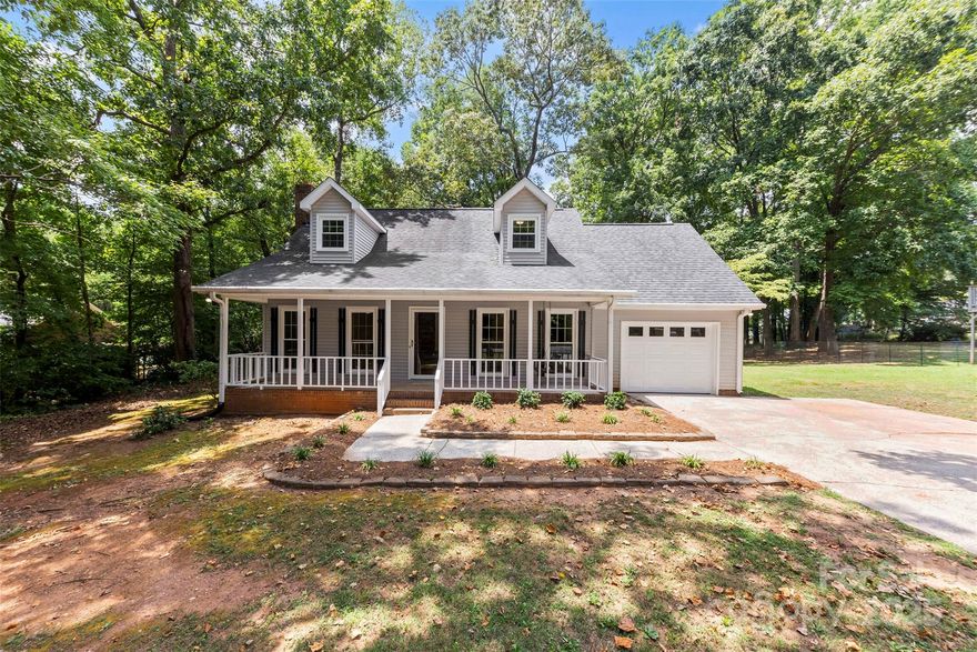 BELMONT LOVERS! This home has been beautifully and tastefully renovated to maintain its original charm, while giving it a modern flare. It offers a tranquil place to retreat with your family. The original primary is on the 2nd level with 2 walk in closets, but with a bedroom on the main, one could choose to make either the primary. The secondary bedroom upstairs offers an ensuite walk in space that could be used as a closet, office or child’s playroom nook.  This home offers so many NEW features! The garage floor is freshly epoxied, and has a completely new garage door. Brand new floors run throughout all of the main areas.  ALL NEW WINDOWS, as well as a new sliding glass back door that leads out to a spacious deck, perfect for grilling or welcoming in fall with a fire pit. The kitchen was given a complete overhaul,  including ALL NEW  appliances, QUARTZ counter tops and a tile backsplash. The backyard shows off mature trees and a flat open lot, perfect for kids to play!