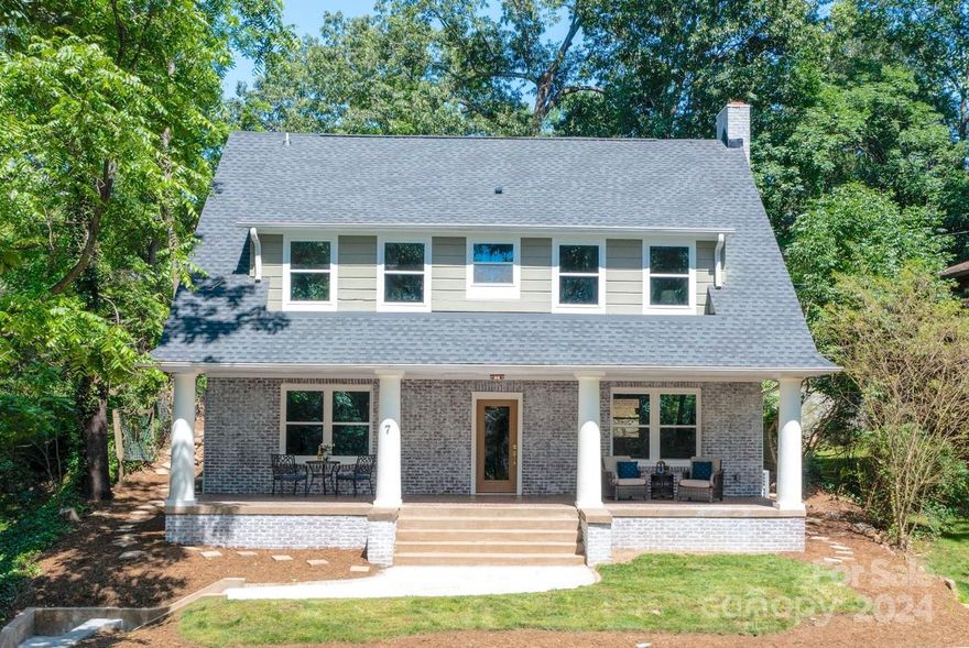 We listened to your feedback and made improvements on this fully renovated Craftsman home. Step inside and experience this beautifully restored 4 bedroom and 3.5 bathroom home that greets you with tall ceilings and shiny hardwood floors, refurbished staircase, and vintage interior doors that echo the home's historic charm. The kitchen features quartz countertops, subway tile backsplash, hardwood cabinets, a 36" farmhouse sink, hood vent and stainless steel appliances. The primary suite on main is a serene retreat, boasting a beautifully appointed en-suite bathroom with a relaxing soaking tub, a walk-in shower, a floating double vanity and custom closet. Upstairs is the ideal set-up for families with 3 bedrooms, a media room and 2 full bathrooms. Laundry and half bathroom are located on main floor. Every detail has been upgraded down to the studs. The result is a home that combines historic allure with the confidence and reliability of a modern new build in the heart of Asheville.