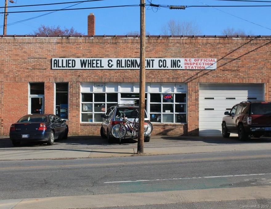 Built in 1928, the 4,971 brick/metal structure boasts six drive-in doors, large windows for natural light, and a 16’ barrel-roof ceiling—a desirable shell ready to be transformed into the types of adaptive reuse projects that Asheville has become known for. Situated on the corner of Haywood Road and Brownwood Avenue, the property includes 15 parking spaces, and is within walking distance to neighborhood residents and dozens of nearby businesses.