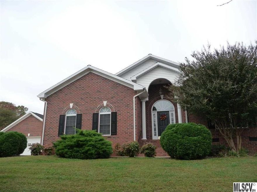 Privacy that's Convenient to shopping, great schools and quick access to Hwy 321, just minutes to both Lenoir and Hickory. Make this beautiful brick home a must see! Located in The Greens, an upscale neighborhood in Granite Falls.  An open floor plan affords a gourmet kitchen with granite counters, wood grain refrigerator front, high quality SS appliances, pot filler & warming drawer along with a 36" cook top, 6' island, breakfast bar & separate dining room. This home features 14' ceilings.The 33' long living room w/gas fireplace provides access to the back screened porch. Main level master suite w/jetted tub, over sized shower, dual sinks plus his & her walk-in closets and private patio. Picasso Travertine in kitchen, Beautiful hardwood floors throughout, Tile floor in master, with carpeting in two bedrooms. Elegance in chair rails, arched entries, beamed ceilings, and more.   Land, property trade or almost anything of value will be considered toward purchase.