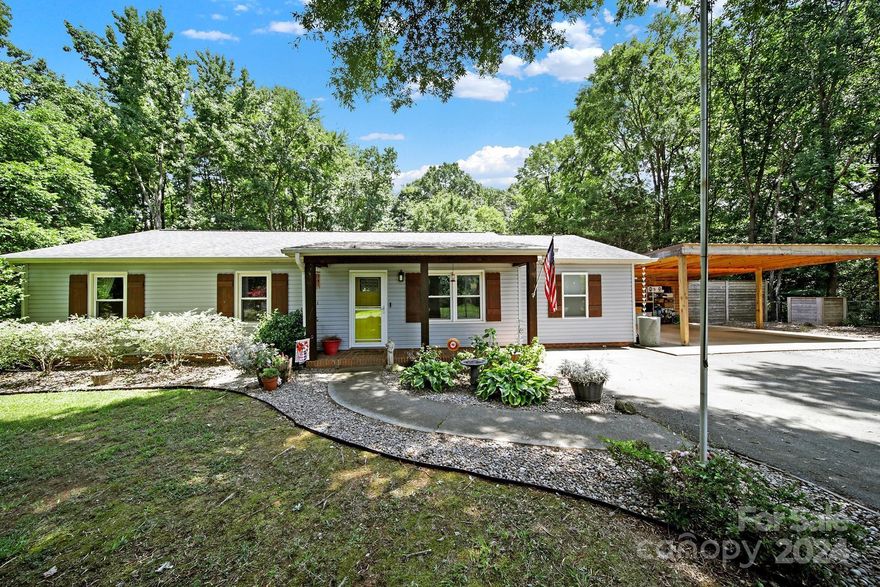 This charming, move-in ready ranch home is filled w/ tons of updates! The open floorplan includes a newly added kitchen featuring bright white cabinets, granite countertops, stainless appliances, a double oven and wine refrigerator. Other updates include bathrooms, new insulated windows, a new front door & durable vinyl flooring in the kitchen, dining & living room. A covered front porch, two-car carport and inviting back patio await you as you delight in the nearly one acre lot. A darling barn-inspired storage building and handy working shed provide storage for all of your tools & equipment, both wired with electricity. City water is connected to the home, however a well line is still connected for garden/drip irrigation. Located on a dead end street, this home offers ample privacy, yet is so close to everything. Convenient to I-485, Independence Blvd., Hwy 51, shopping, dining, hospitals, & a short 20 minute drive to uptown Charlotte! Brand new roof installed in August of this year!