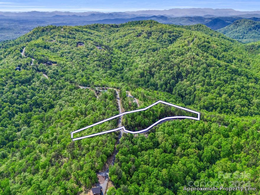 BEAUTIFUL MOUNTAIN VIEWS, PRICED BELOW TAX VALUE!! DON'T MISS OUT ON THIS ONE!  This is a corner lot in located in the picturesque and gated community of Yellowtop Mountain Estates. With some clearing this lot would have an amazing long-range view. It features approx. 3 acres on one side of the road and appox. 1/2 acres on the other to allow for access to your views. Whether you are planning to build for a vacation home, Airbnb, or a full time home, you will be tucked away in the beautiful mountains of North Carolina where you will be within an hour to Asheville, Charlotte, and Spartanburg.  The amenities of Forest City, Rutherfordton, Lake Lure and Chimney Rock are all within 20 to 45 mins. Come Build your home and enjoy the beautiful mountains of Rutherford County! 
Spectrum Fiber Optic Installation Begins Feb 9th.