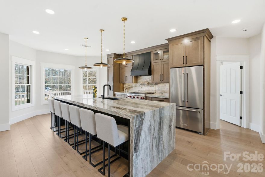 Experience breathtaking sunsets and serene waterfront living in this beautifully renovated Lake Norman retreat, ideally situated just around the bend from the main channel. This exceptional property offers the rare advantage of no HOA and permits short-term rentals, making it perfect as a primary residence, vacation home, or investment opportunity. The home has been completely renovated and features a stunning chef’s kitchen equipped with premium Wolf appliances, along with a luxurious primary suite showcasing a spa-inspired bath. Two additional bedrooms, a full bath, and a half bath complete the main level. The finished basement serves as a fully functional second living quarters, offering a second kitchen with bar seating, a spacious living area, a bedroom, a full bath, and ample storage—ideal for guests, multi-generational living, or rental income potential. Enjoy effortless lake access with your own private floating dock and private boat ramp. Outdoor living is exceptional, featuring a screened porch, an upper-level deck, and underdecking that creates a covered walkout patio below—perfect for relaxing or entertaining year-round. An in-ground irrigation system adds convenience and ease of maintenance. Conveniently located near I-77 and just minutes from dining and shopping, this home offers luxury, flexibility, and the ultimate Lake Norman lifestyle.