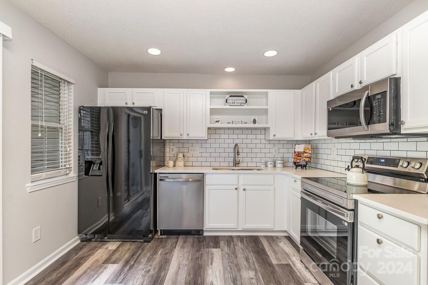 Welcome to your new townhome in Kimmerly Woods! This stunning 3-bedroom, 2.5-bath townhome is ready for you to move right in. Freshly updated with beautiful new LVP flooring on the main level and fresh paint throughout, this home feels both cozy and contemporary. The kitchen has been thoughtfully renovated with new cabinetry, sleek countertops, a stylish backsplash, and brand-new appliances (excluding the refrigerator). Whether you're entertaining or relaxing, this space perfectly balances comfort and style. Don't miss out—schedule your visit today and make this townhome yours!