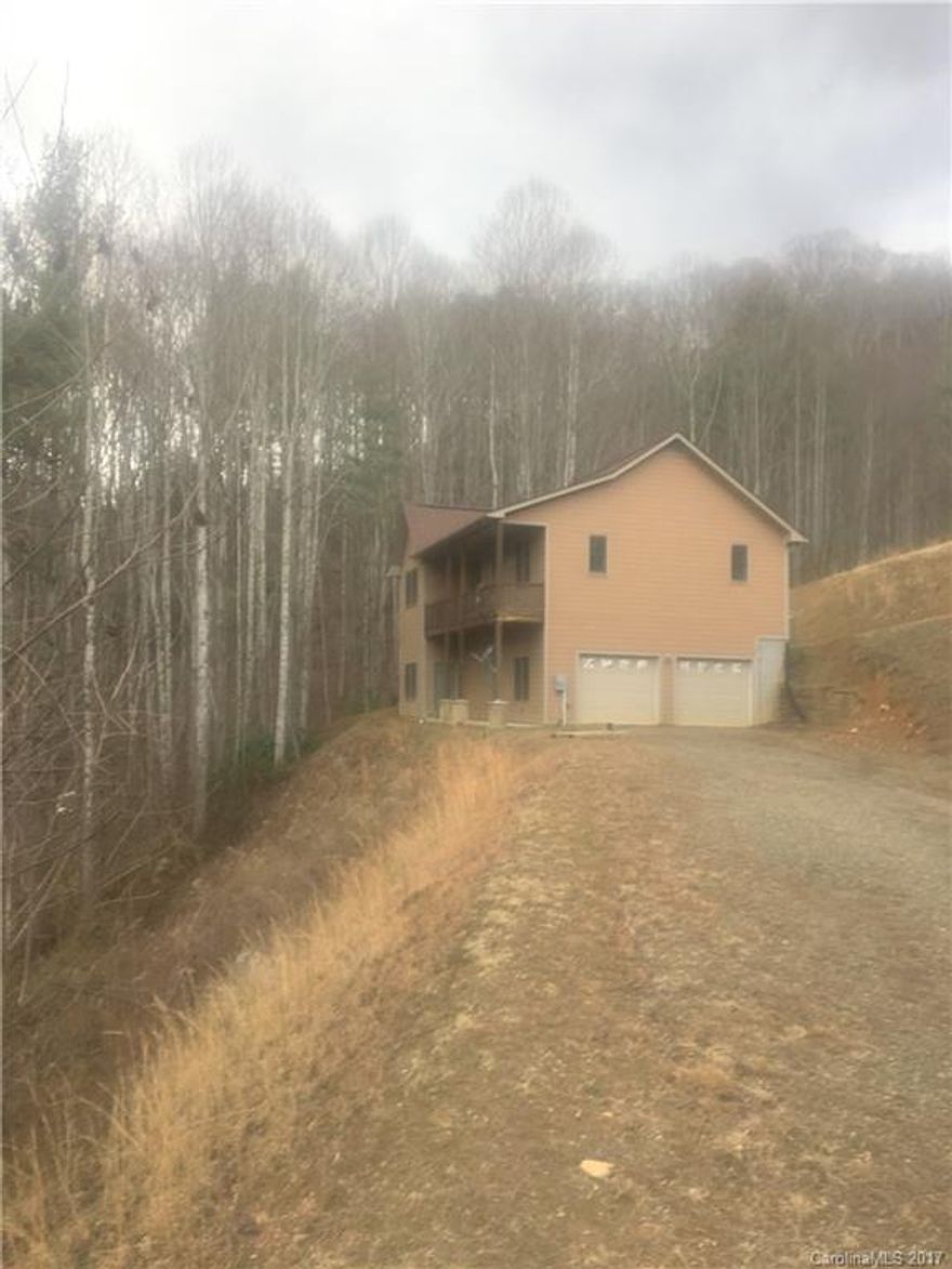 Bank Owned home in great condition! Charming 3 Bedroom 2.5 baths with lower level recreation room with wet bar.  Oversized double garage on lower level with extra room for storage. Located in a beautiful area of Haywood County and convenient to Cataloochee Ski Area.  Road and driveway are steep but can be accessed with 4WD or SUV. Proof of Funds  or preapproval letter is required with all offers.