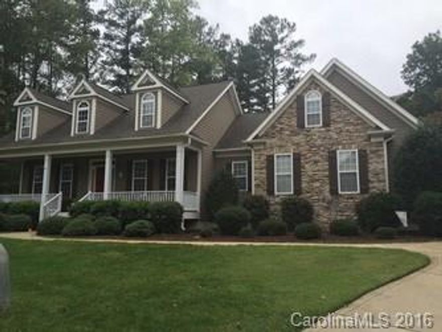 Well-kept, move-in ready stone front ranch home on large cul de sac lot in beautiful lake community.  Spacious open floorplan.  Don't miss this opportunity; main floor includes formal dining room, sunny breakfast nook, kitchen that opens to great room with gas log fireplace and soaring ceilings. Huge master suite and 3 additional bedrooms (one with french doors can be an office).  Finished bonus room/game room above garage.  Covered rocking chair porch on front & rear.  Fenced backyard.