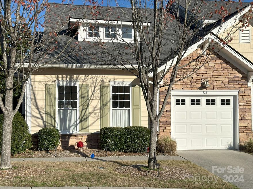 This immaculate townhome is freshly painted with dramatic high ceilings and has New Granite Counter Tops, Custom Plantation Blind covering,  Master Bath Shower. The spacious 1 car garage has additional built-in shelving. The Flex space make for an ideal office niche. New roof installed 2019 In addition, for those Boat and water
enthusiast there is easy access to Lake Wylie. Also, this home is within walking distance to the Tega Cay Golf and Country Club, practice facility and Club House. Love the short drive to the Rivergate shopping area. Enjoy getting to the Charlotte Airport without using the highways too