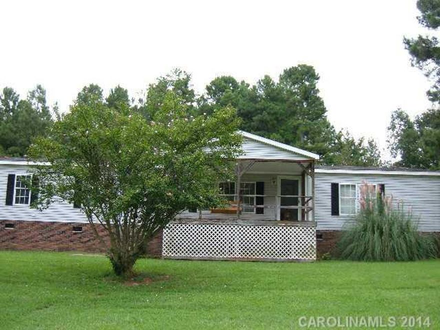 Doublewide mobile home on over 4 acres. New range (2010) HVAC, heat pump in 2010. Room to Room, with over 2300 heated square feet. Largeworkshop/shed/det. gar Rockery Chair front porch & large covered back deck. Home and Workshop SOLD AS IS!