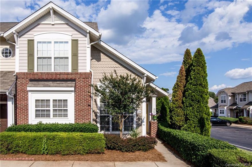 Fantastic end unit in a great location! Bright and clean with new carpet on main floor and stairs.   Open living space with vaulted ceiling features corner gas log fireplace.  Dining room w/arched opening, chair rail and wainscoting.  Nice kitchen w/plenty of cabinet and storage space.  Good closet space.  Fenced outdoor area also has small storage shed.  Close to restaurants, shopping and I-77!