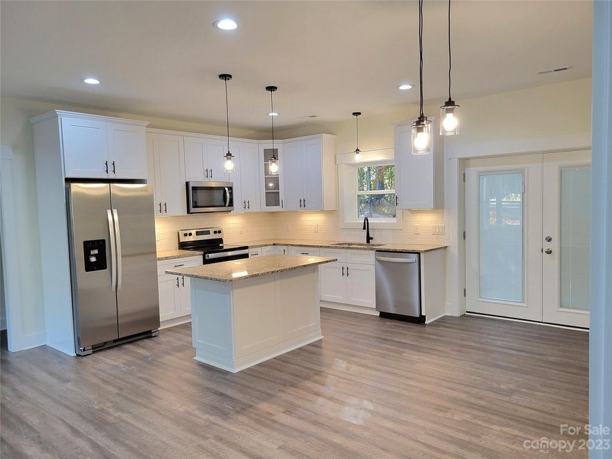 NEW CONSTRUCTION! Live your best lake life in this Beautiful open concept Bungalow with 9 foot high ceilings! Just a few streets down from the boat ramp, convenient to 2 swim beaches, picnic area, & a fishing pier. This home offers R20 efficiency with it's 10 inch thick (Exterior)Superior cement walls. Granite counter tops, custom cabinets, and an island with room for seating in this open concept home give you an updated style that will be around for years. The primary bedroom, with ensuite bathroom, is on the opposite side of the house from the 2 secondary bedrooms giving you plenty of privacy. Ride your golf cart around and enjoy the amenities that Pinehaven Villiage has to offer. Full time, part-time, or Air BNB you don't want to miss out on this one!