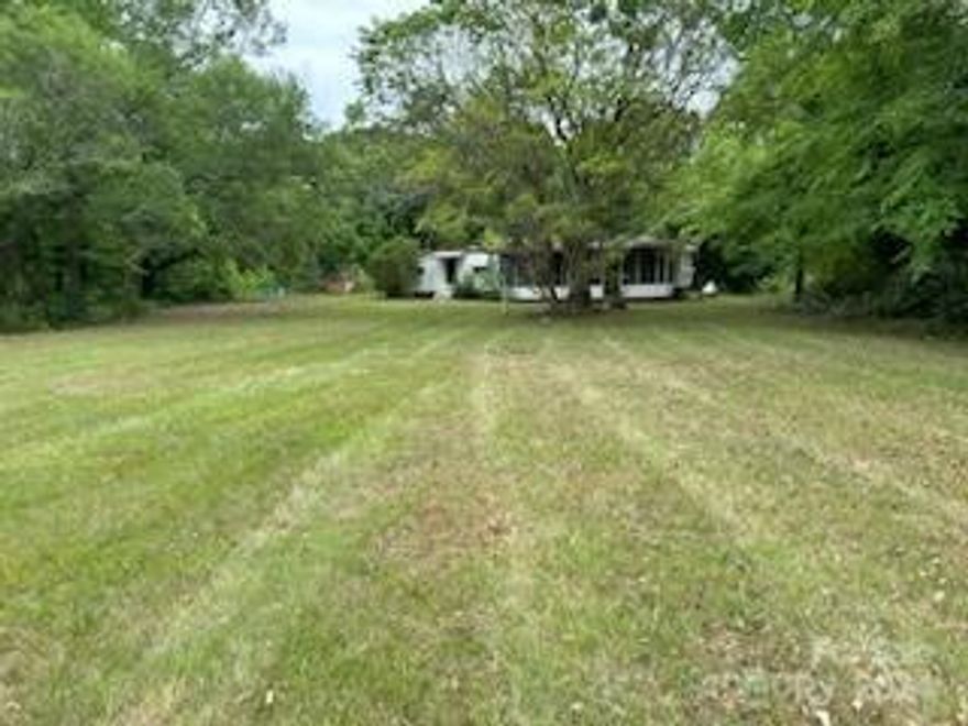 7.33 +/- acres in 2 tax parcels combined on Saluda Road with a 1966 vacant mobile home given no value. There is a well and septic both believed to be operational and a 24 x 20 metal building suitable for a shop or garage. Nice yard and buildings are set back from the road.