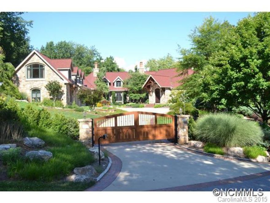 This luxury, gated estate near downtown Asheville is situated on over 3 private acres and bordered by a bold creek. Designed by Mark Sinsky & built by Robey Wright, you will find gracious appointments throughout this exquisite home. The interior features breathtaking woodwork, massive ceilings, 3 large FPs & a 1000 bottle climate controlled wine closet. 3-car garage w/ showrooms. Unmatched quality and attention to detail!  See list of features!