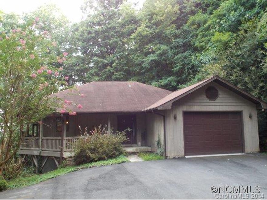 This charming home with mountain views is an affordable country club get away.  New hardwood floors throughout, wrap around deck with sliding glass doors, and a large garage in a gated community.