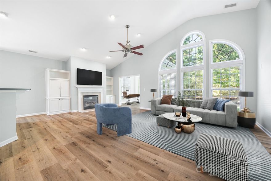 This gorgeous Move in Ready home nestled perfectly within an age targeted 55+ Community including all the amenities and activities you could want, or chose not to do, all new flooring, paint and some new light fixtures.  At the time of construction this home had numerous builder upgrades such as brick front, bay windows, sunroom with HVAC, French Doors, Gourmet style kitchen with Double Ovens, gas cooktop, Hard Wired for Surround Sound, a split floorplan for privacy, permanent stairs to a large over the garage storage room, Luxury Primary Bathroom with Double Bowl Sinks and Jacuzzi style Tub separate from Shower is ready for you to make her yours.  HVAC +/-3 yrs, tankless water +/-3 yrs. Roof in 2011, The Beautiful home also boasts a Central Vacuum system, Newer Refrigerator and Dishwasher and has only had 1 owner lovingly maintain and live in the home.  Lawncare and trash services are a part of the HOA dues along with all the amenities of Perfectly Located Four Season at Gold Hill.