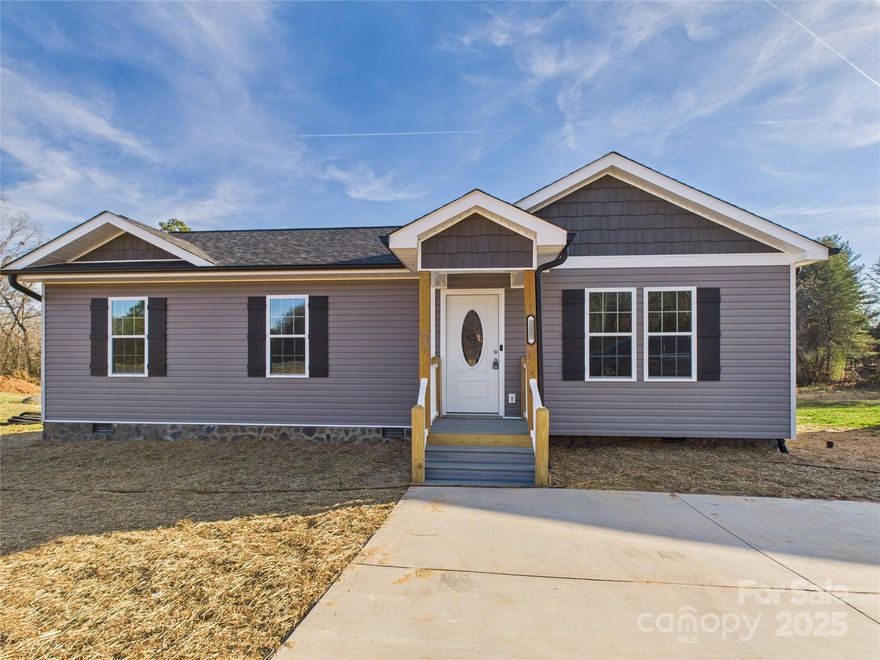 NEW CONSTRUCTION 3 Bedroom/2 Bath one level home in the heart of Hudson...Home features include granite countertops, stainless appliances, custom kitchen cabinets, durable and attractive LVP flooring throughout, 2 full baths. Primary bath features a bluetooth speaker exhaust fan. Concrete parking and sidewalk. 1 year builder warranty included. Estimated completion is 1/1/26