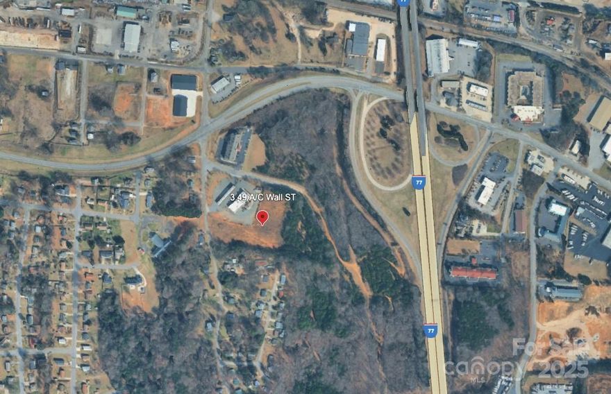 3.49 AC± Off Exit 49B on I-77 in Statesville, Zoned B5 General Business. A prime real estate opportunity for your business. This versatile property is now available for purchase and is ideally suited for a wide range of business operations, including Automotive and Equipment; Auto Rental, Sales, and Service; Boat, Motorcycle, and Trailer Sales and Service; Large Equipment, Farm, Heavy Equipment Sales and Rental; Manufactured/Mobile Home and RV Sales.

With off-street parking, this location offers excellent accessibility and visibility, making it a lucrative spot for businesses looking to attract significant traffic and attention. Whether you are an established company or a growing enterprise, this commercial property offers an exceptional opportunity to develop your business in the heart of Statesville’s thriving commercial hub!