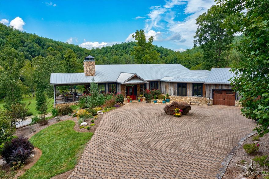 Imagine a lifestyle w/mountains, rivers, trails, sports activities, gardens, and a close-knit community all at your fingertips while living in the developer’s furnished home nestled on a private 12-acre peninsula of manicured grounds. Included furnishings offer immediate enjoyment. Surrounded by a 1/2 mile of Johns River frontage, trails, 1.5-acre fishing pond & equestrian features providing convenience & a healthy lifestyle for both you & your 4-legged friends. Enjoy all of the views from your porch, covered deck w/fireplace & walls of windows in every room of the home with a bright open floor plan ideal for entertaining on both levels. Constructed of low maintenance, resilient reclaimed barn wood & metal roof, the home features river stone walls, tongue & groove cathedral ceilings, stone fireplaces, granite & tile with a strong luxury & quality feel throughout. Escape to your own fresh air oasis as a vacation or full-time home. Additional 5 acres available, call for more information.