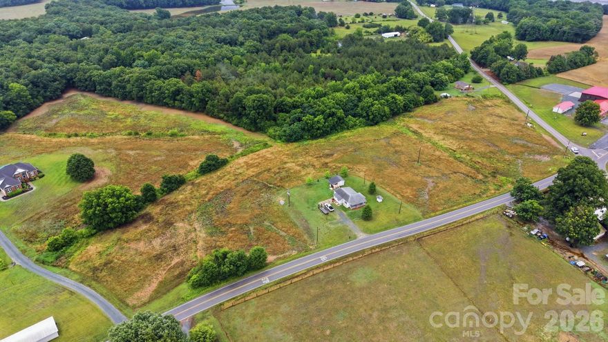 8.58+/- acres but located 10 minutes from Monroe, Marshville and Wingate plus 10 minutes to the Monroe bypass giving you quick access to Charlotte, Indian Trail and Matthews. This gently rolling land has multiple home sites that have preliminary soil work for septic systems. Road frontage on Old Pageland Marshville Road and White Store Road. This property also has access to county water which is a big plus for rural properties. Being close to fire dept and having county water may decrease your homeowner's insurance premium. Buy this 8.58 +/- acres for what a few acres cost in other areas of the county. Buy for an investment! Land prices will continue to increase!