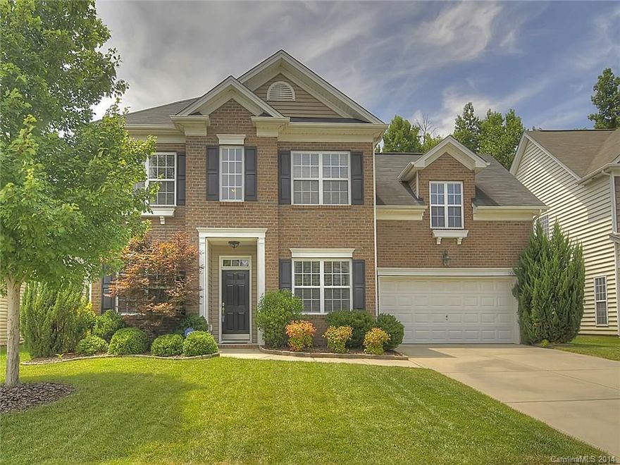 Gorgeous wooded yard in Providence Pointe. Sunny move-in ready home has four bedrooms plus 5th bedroom/bonus room on main floor. Features gleaming Brazilian cherry hardwood floors & custom oak shelving with built-in lighting in Great Room. Granite & travertine tile in kitchen. Large pantry. Vaulted master suite. Patio with stone wall and pergola overlooks private backyard. Irrigation, sound & structured cabling plus security system.