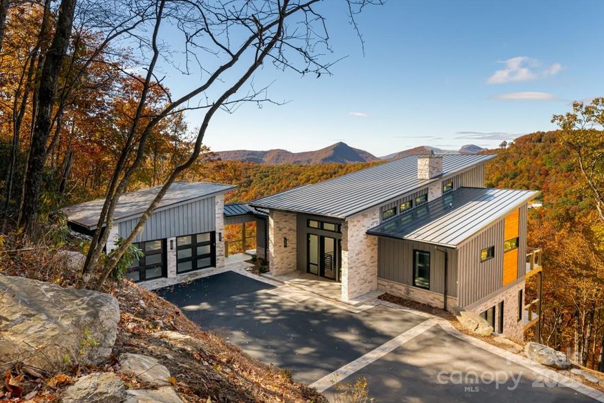 Check out this Mountain Modern Marvel, a premier Divide Property now completed upon 5+ acres with fabulous southwesterly mountain views atop Eastern Continental Divide. Enjoy the modern open floorplan with 3 bedroom suites & 3.5 Bathrooms at over 4000' elevation close to Pavilion & Panthertown Valley Preserve. There are plenty of covered & open decks, plus a breezeway attached 2 car garage. Bald Rock residents enjoy Large Private Estate-sized parcels with Gated Entry, Paved Roads & Underground Utilities including Fiber Optic Internet. Available amenities include the Divide Pavilion, the Bald Rock Equestrian Center & hiking/riding trails, plus all Sapphire Valley Resort Amenities. Built by Westmark Construction. This is your chance to own a unique and incredible mountain dream!