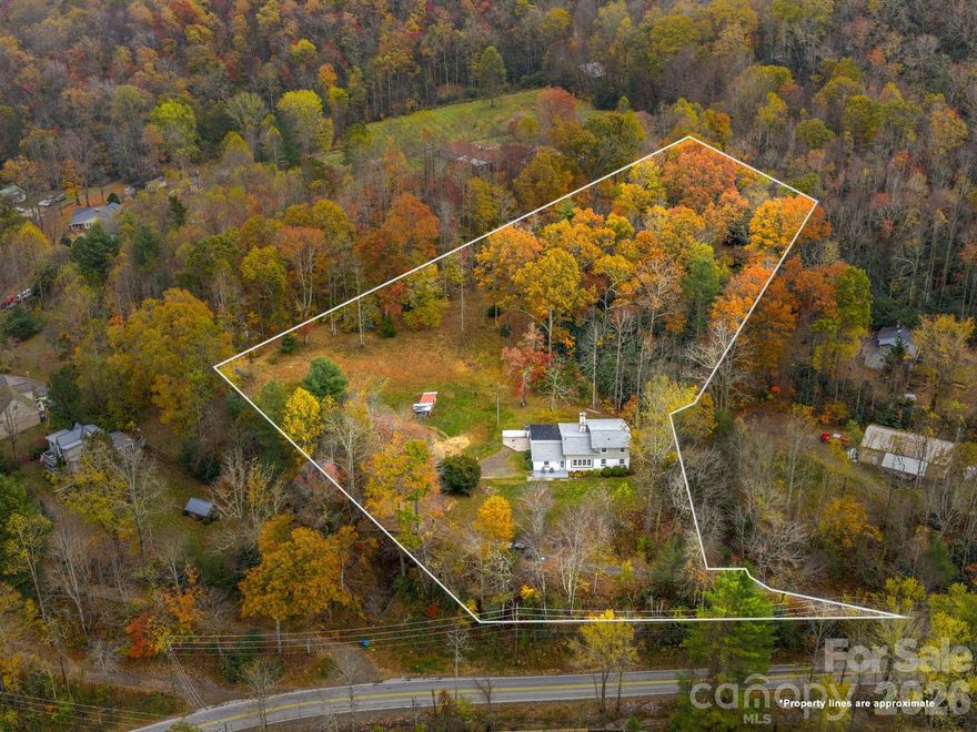 FAIRVIEW BEAUTY ON 2.58 GORGEOUS, USABLE ACRES WITH NEW ADDITION & TURNKEY UPDATES! Exceptionally maintained and thoughtfully renovated 4BD/3BA home offering 2,834± sq ft of comfortable, flexible living in peaceful Fairview. Designed for both everyday ease and effortless entertaining, this home features a serene main-level primary suite and an inviting open floor plan enhanced by rich hardwoods and radiant heated tile floors. The newly renovated gourmet kitchen is a true centerpiece, showcasing granite countertops, double ovens, and a gas cooktop perfect for gathering and creating memorable meals. A spacious addition offers incredible versatility with options for a home office, media room, playroom, and private ensuite guest quarters. Generous secondary bedrooms and updated baths in the original home provide comfort and privacy for family and guests alike.
Major system updates including a new roof, HVAC, and expanded four-bedroom septic system ensure peace of mind and truly turnkey living. Set on 2.58 beautiful, usable acres, the property offers endless possibilities for outdoor living, gardening, or simply enjoying the privacy and tranquility of Western North Carolina. A rare Fairview gem that's move-in ready and waiting to welcome you home. Short-term rentals permitted!