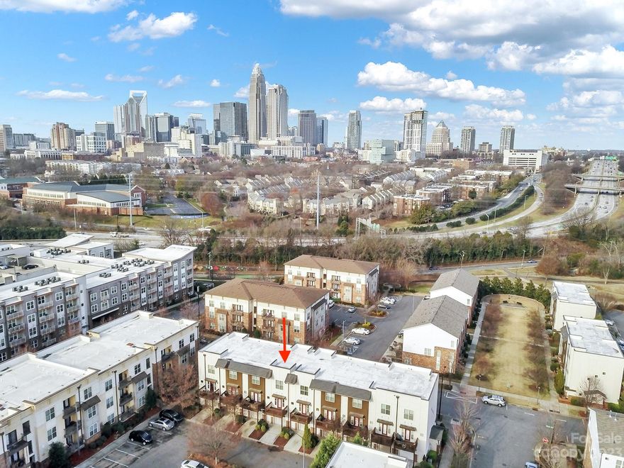 PRICE REDUCED! Amazing opportunity to live in one of the most sought after locations in Charlotte! This townhouse-style condo with skyline views of the city is freshly painted and move-in ready. Offering 3 bedrooms and 3 full bathrooms, each with their own ensuite. Recently updated kitchen features Shaker style cabinets with soft-close drawers, quartz countertops, glass tile backsplash, light fixtures, faucet, and an island with farmhouse sink. Spacious great room is perfect for relaxing or entertaining. Lower level bedroom could be an ideal office. Enjoy the outside with the front balcony and back deck. Attached, oversized one-car garage with workbench and storage. Easy access to NoDa, Plaza Midwood, Uptown, Optimist Hall, Little Sugar Creek Greenway, public tennis courts, and I-277. Exterior painted in 2023 including doors, handrails, and deck. Smart Home front door keyless entry. Stackable washer/dryer and kitchen refrigerator to remain.
