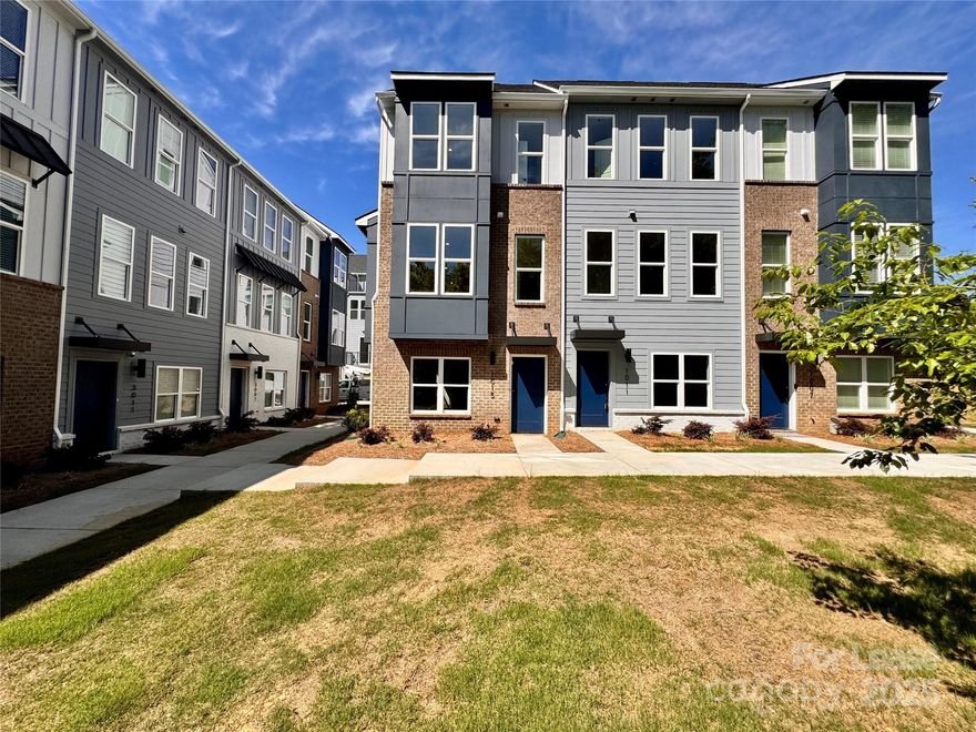 Experience elevated living in this brand-new, four-story townhome located just minutes from Uptown Charlotte and Camp North End. This stunning residence offers the perfect blend of modern luxury and urban convenience, featuring 3 spacious bedrooms, 3 full bathrooms, and a convenient powder room. The open-concept living area is anchored by an oversized kitchen island, complemented by sleek stainless steel appliances—ideal for both everyday living and entertaining.

One of the home’s standout features is the expansive rooftop terrace, offering a private outdoor retreat with sweeping views—perfect for relaxing evenings or hosting guests. Additional highlights include a two-car garage, a full-size washer and dryer, and thoughtfully designed living spaces that provide comfort and style on every level. Don’t miss the chance to make this exceptional townhome your next home in the heart of Charlotte.