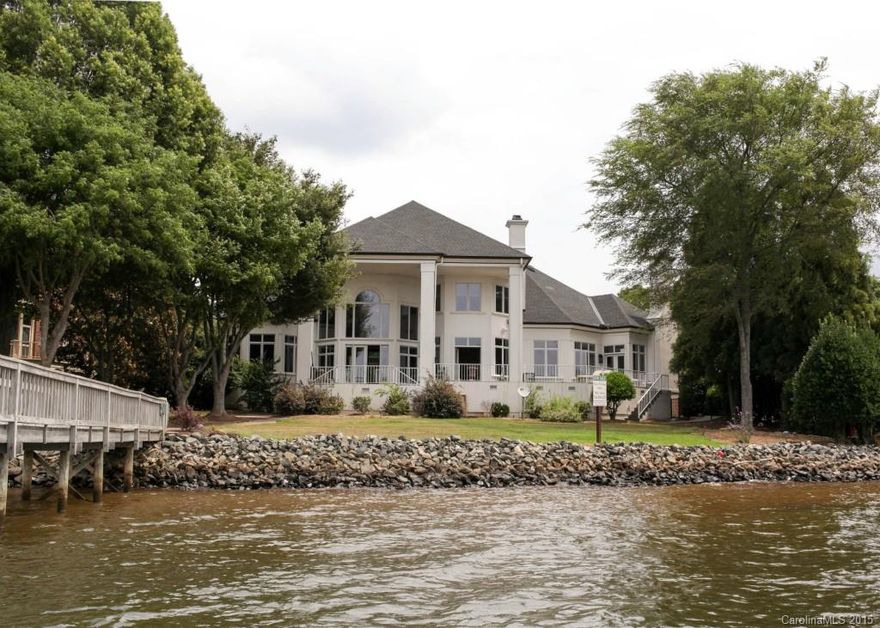 5BR/ 3/2 BA, on 152' stunning Lake Norman waterfront in the highly sought after Peninsula. Grand Entrance w/spiral staircase, opens to 2sty GreatRoom. Vast windows from floor to ceiling allow for AMAZING wide-open views! Gourmet kitchen features 7' Viking Refrigerator, dual ovens, warming drawer, dual sinks, Insta-Hot. THREE wood-burning stoves, stacked fireplace, expansive patio.Short Sale DREAM!