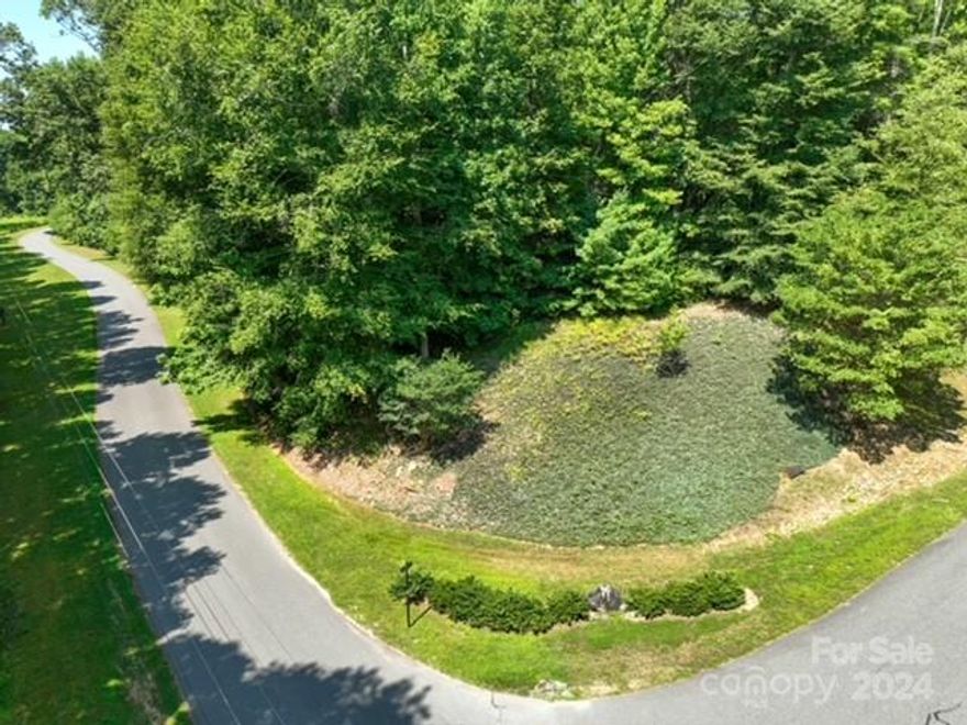 Come see this unique 2.05 acre lot on Ginseng Lane in The Wildwoods of Lenoir.  This exceptional level corner lot is ready for your dream home. Caldwell County water meter already installed. Septic permit for a conventional 4 bedroom. Underground internet/cable service.  In a desirable up and coming neighborhood with beautiful homes. This rare mountain land is located only a couple of miles from Cedar Rock Country Club and only minutes to the town of Lenoir.  The quaint Village of Blowing Rock and the Blue Ridge Parkway is 30 minutes away.  Charlotte Douglas International Airport is an easy two hour drive to catch a flight.  You will love the peaceful area with lots of wildlife.