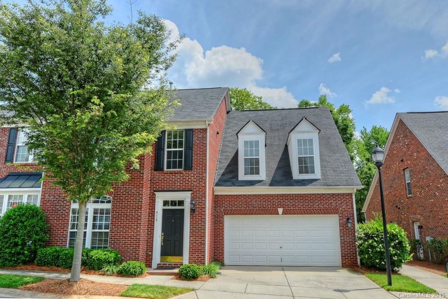 Lovingly maintained full brick end unit w/original owner & over 2600 SF includes mstr suite & lndry on main level. Hdwd flrs thru-out main level, except mstr bath. Oversized DR & bulters pantry for entertaining. Open kitchen & GR w/ soaring ceiling & gas FP. Kitchen features 42 inch cabs, granite counters & blk applnces. 2 lg bdrms up w/ storage space. Best location in this exclusive complex. No drive thru traffic & backs up to wooded beautiful scene. Walk to shopping! Tankless water heater 2009