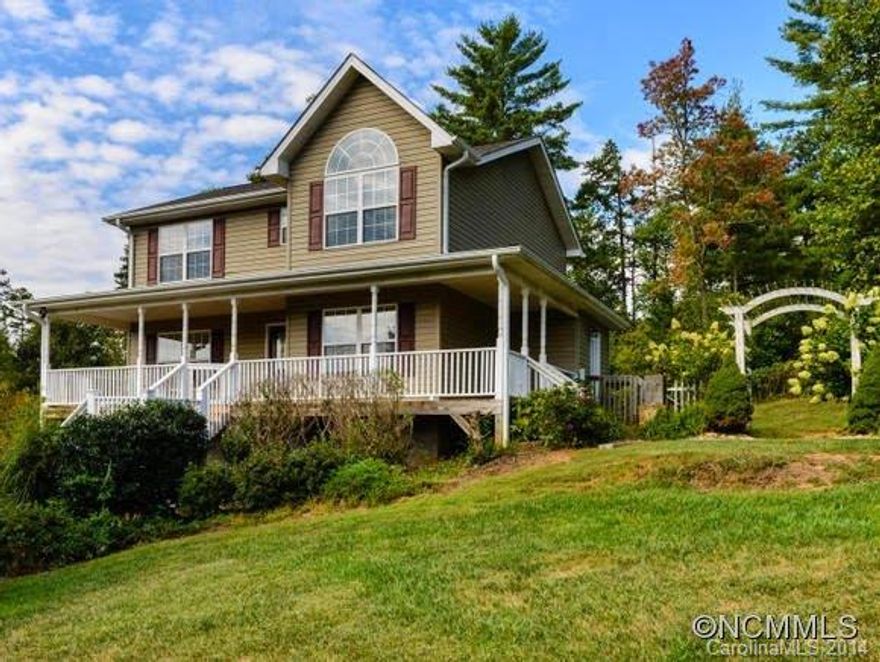 Only 15 minutes to downtown Asheville and 5 minutes to downtown Weaverville. Private setting with deck and fenced back yard, in area of nice homes. Spacious kitchen with stainless appliances. Quality laminate floors throughout living and dining areas. New 30-year roof in 2012. Bonus room + room to expand in basement. Walk-in closets and storage. Wonderful wraparound covered porch is the perfect place to enjoy the beautiful surroundings.