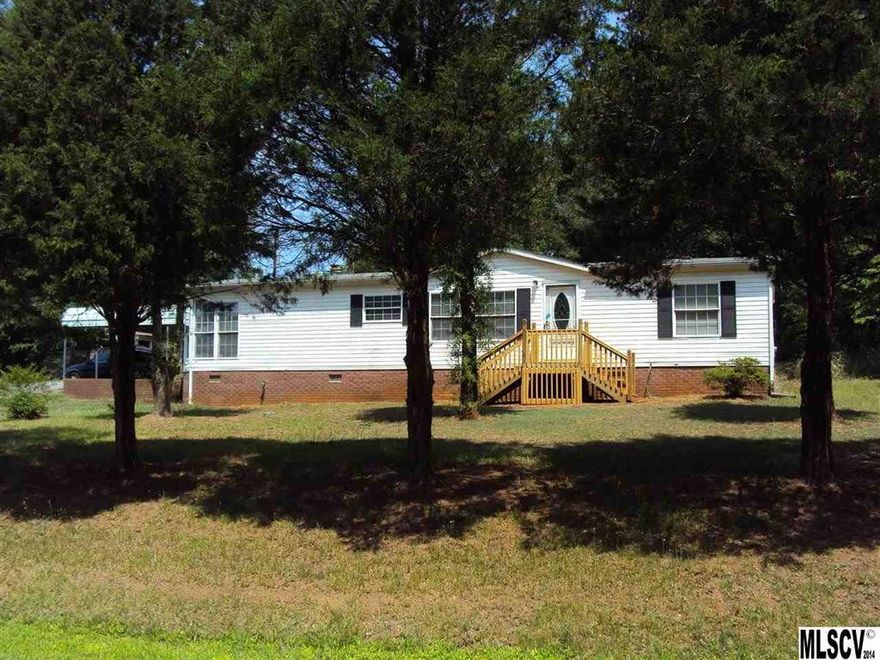 Move-In ready!  This home offers a private country setting on a quiet road.  Three bedrooms and two baths. All new paint. New floor coverings. All new deck and porches. Sunny dining area. Vaulted ceiling in living room. Master bedroom with walk-in closet. This home was built handicap accessible. Brick storage building.