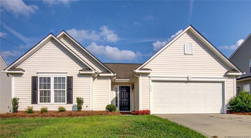 NEW ROOF getting put on this MOVE IN READY home!! ALL NEW Paint, Carpet, Blinds and Brushed Nickel hardware on doors. Gorgeous new stainless steel WHIRLPOOL appliances, including refrigerator! Behind the home is HOA green space making for a beautiful extension of the backyard.