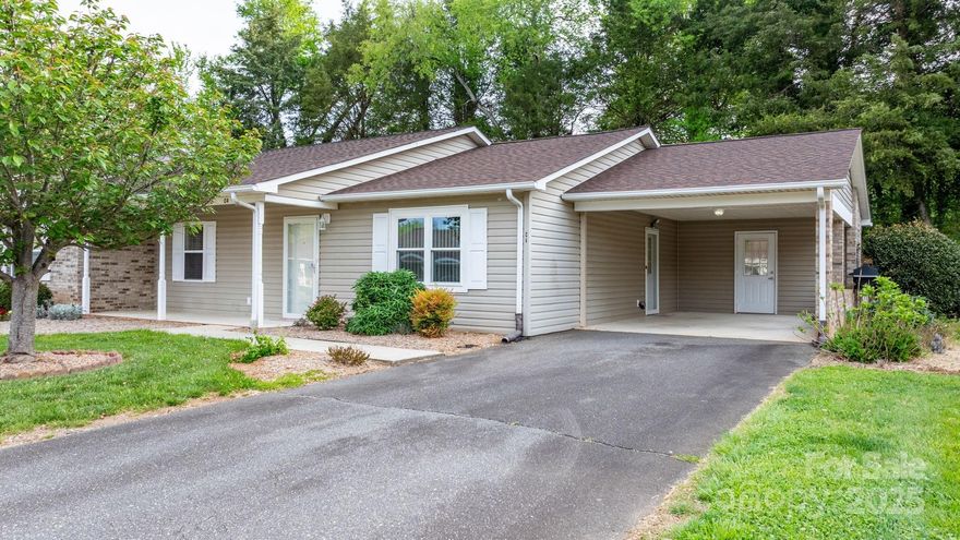 Spacious, move-in ready townhouse with easy one-level access. The large primary suite features a walk-in closet and walk-in shower. Guest bedroom offers a full wall closet. Open living area with a custom gas log fireplace.

The kitchen includes deep custom cabinets, pull-out shelves, granite countertops, stainless steel appliances, and a wrap-around island. Bay window brings in plenty of natural light.

Located in a desirable Conover neighborhood with a new roof (2018) and a tankless water heater. Thoughtfully designed with custom features throughout!

Additional highlights include a covered carport for convenient parking and a utility closet offering extra storage space.