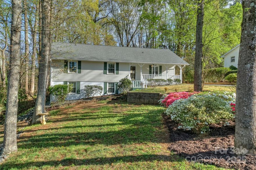 Welcome to this charming 3 bedroom, 2 bathroom ranch home with NO HOA, situated on 0.65 acres! Beautiful hardwood floors flow throughout the home, and the oversized primary suite features a sitting area and walk-in closet. The family room, complete with a gas fireplace, custom built-ins, and a skylight, creates a cozy and inviting atmosphere. The kitchen boasts elegant white cabinetry, granite countertops, and a stylish backsplash. Enjoy a relaxing cup of coffee on the rocking-chair front porch. The private backyard includes a deck and fire pit, perfect for outdoor gatherings. Recent updates include fresh interior and exterior paint, carpet, recessed lighting, blinds, doors, landscaping, & water heater. The bonus spaces include a spacious attic with walk-around room and an expansive unfinished basement. Conveniently located just mins to Uptown Charlotte, I-77 and I-85, and 8 miles from Charlotte Airport. Don’t miss this fantastic opportunity to own a beautiful home in a prime location!
