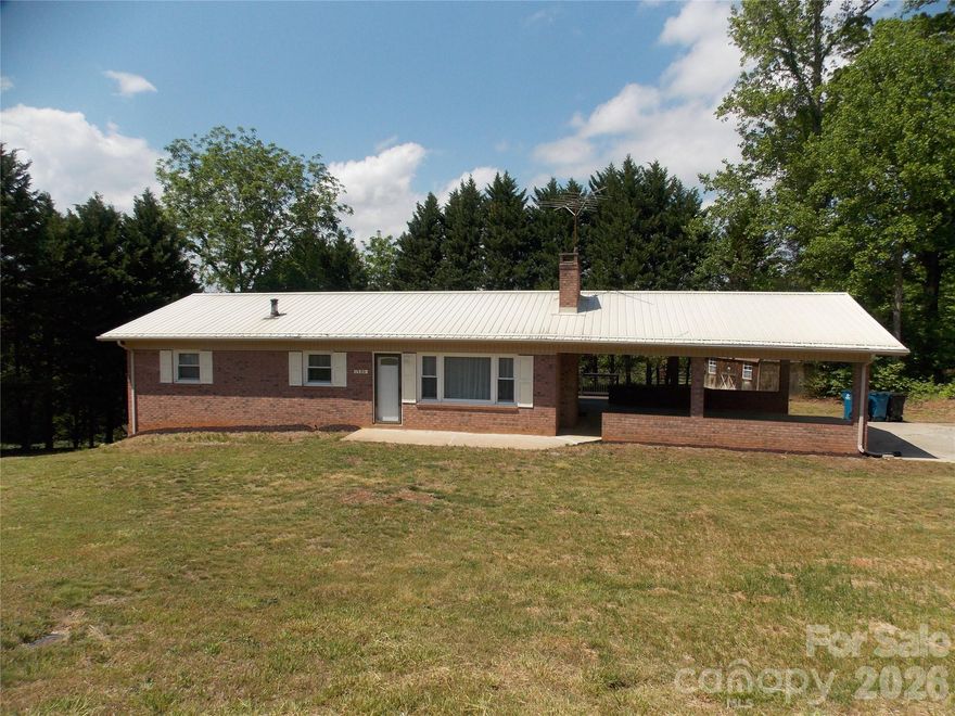 Country living in a great location..This 3 bedroom 2 bath brick home on 3/4 of an acre features lvp new LVP Flooring throughout the home. With 3 bedrooms and 1 bath on the main level along with a spacious cozy living room and a beautiful kitchen w/ dining area make you feel right at home. The partially finished basement includes a hugh den area and a full bath. The unfinished portion of the basement offers a great space for a workshop, or gym. Also lots of storage. The oversized double attached carport is a great parking area as well as entertaining and cookouts along with the step onto deck from the carport. Also plenty of storage in the 2 spacious storage buildings on the property. This is one you don't want to miss!
