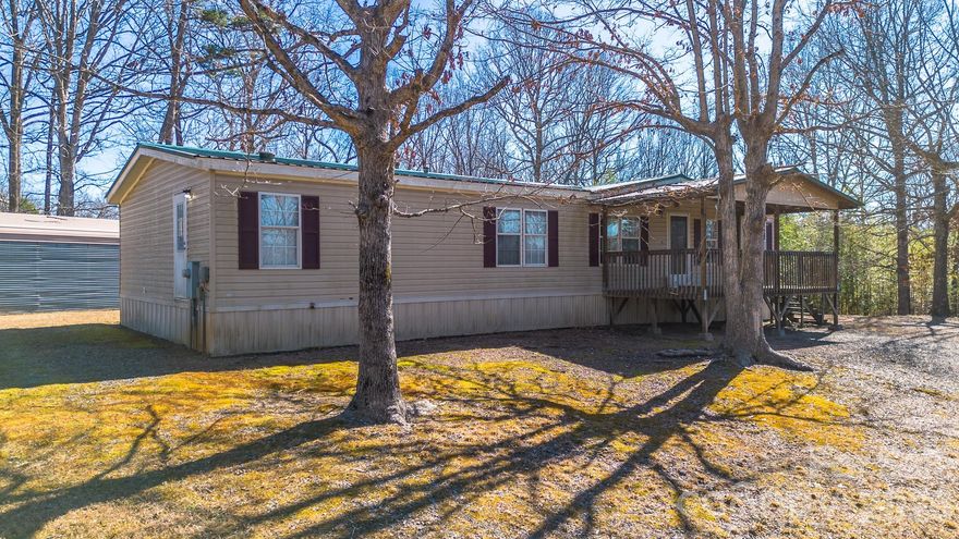 Three bedroom, 2 bath doublewide on over 7 acres! Bring your brush and hammer. Some TLC will get this one back into shape for you or tenants. Explore your own bamboo grove!