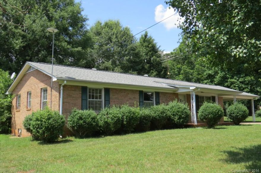 Nice 3 Bedroom brick home in Statesville. Home offers open living room, kitchen, and dining room.  Hardwood floors throughout home. 2 car attached carport, paved drive, large covered patio.  Master has a half bath. Nice back yard with small outbuilding. Roof replaced in 2006. Convenient to Interstates and shopping/restaurants. Interior has been freshly painted. Priced under tax value!